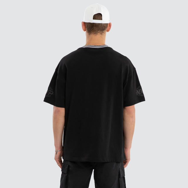 Model wears Fame Raptor Tee Anthracite Black T-Shirts in Black - Image 3