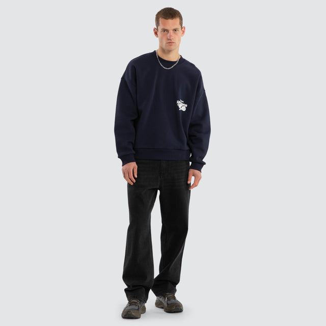 Model wears Fray Motion Box Fit Sweater Black Iris Jumpers in Black - Image 6