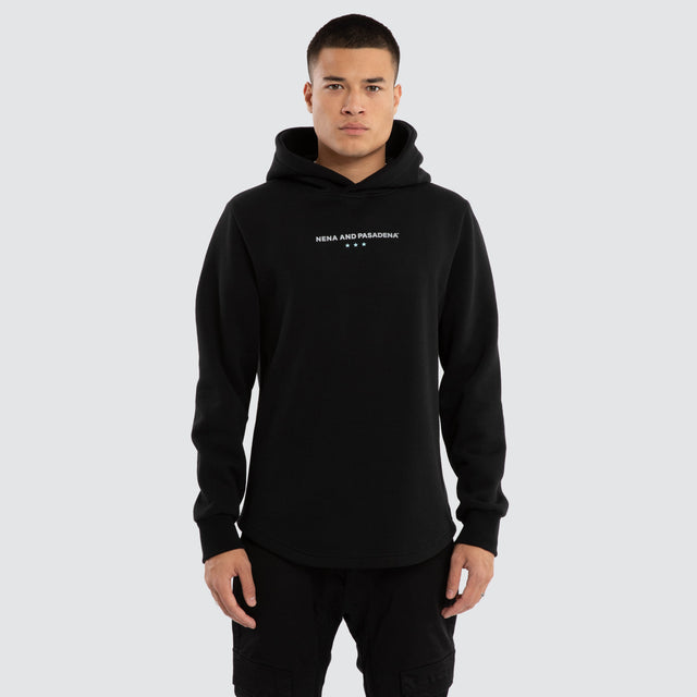 Model wears Unleash Curved Hem Hoodie Jet Black Hoodies in Black - Image 1