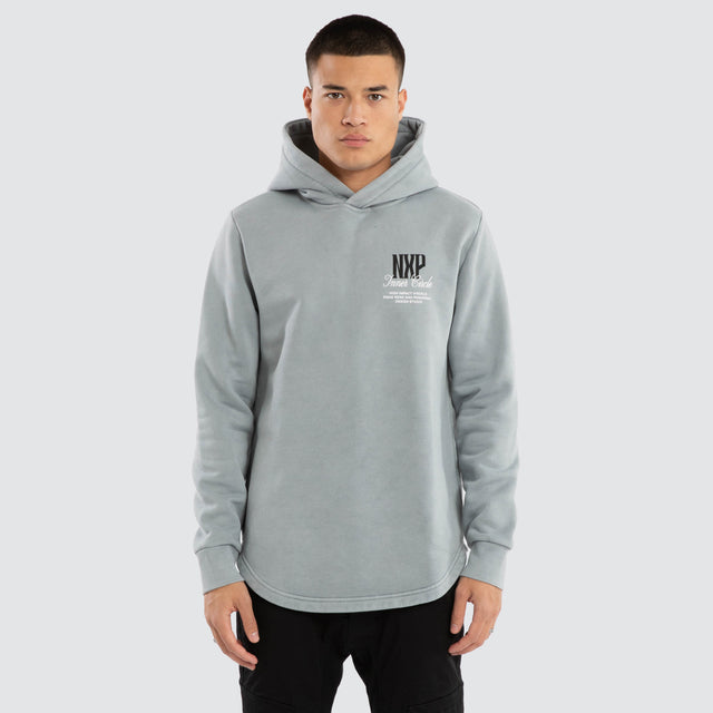 Model wears Dynamic Curved Hem Hoodie Pigment Grey Hoodies in Grey - Image 1