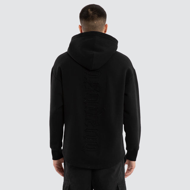 Model wears Supreme Relaxed Curved Hoodie Jet Black Hoodies in Black - Image 4