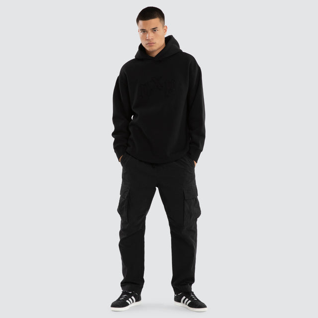 Model wears Supreme Relaxed Curved Hoodie Jet Black Hoodies in Black - Image 5
