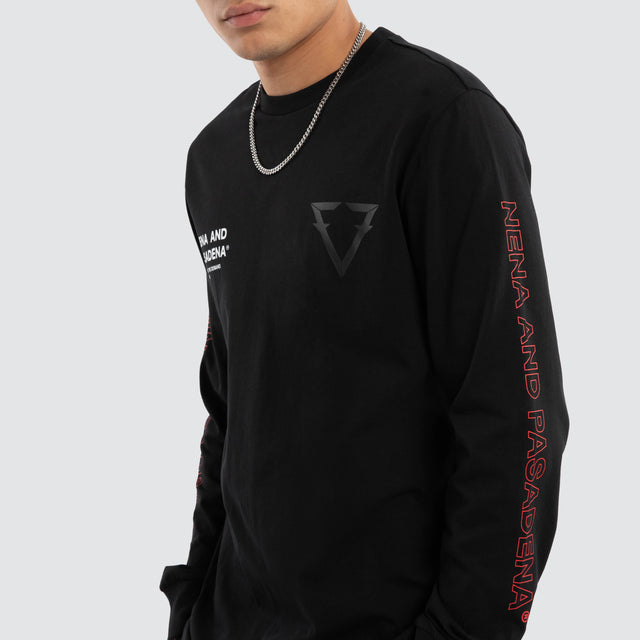 Model wears Unite Curved Hem Longsleeve Tee Jet Black Longsleeve T-Shirts in Black - Image 4