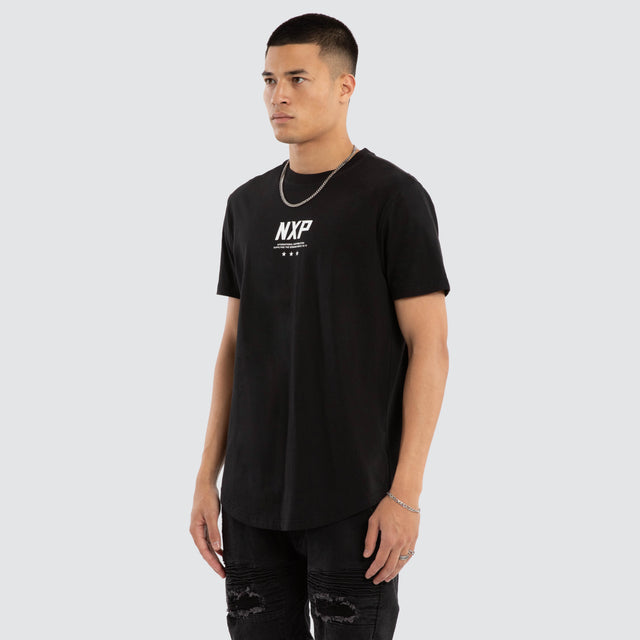 Model wears Synergy Curved Hem Tee Jet Black T-Shirts in Black - Image 4