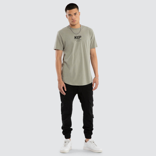 Model wears Synergy Curved Hem Tee in Grey T-Shirts in Grey - Image 2