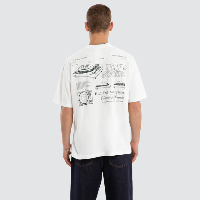 Model wears Audiophile Box Fit Tee Natural White T-Shirts in White - Image 4