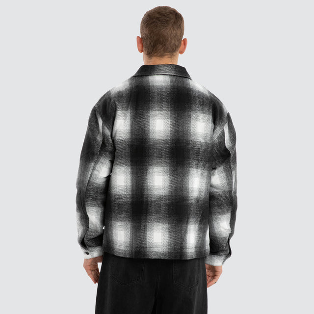Model wears Rise Relaxed Jacket Black/White Check Jacket in Black - Image 3