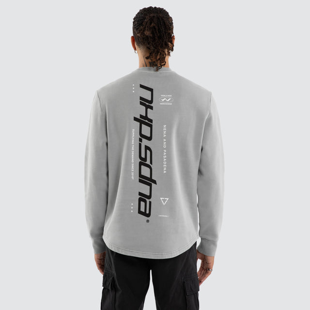 Model wears Independent Curved Sweater Pigment Ultimate Grey Jumpers in Grey - Image 4