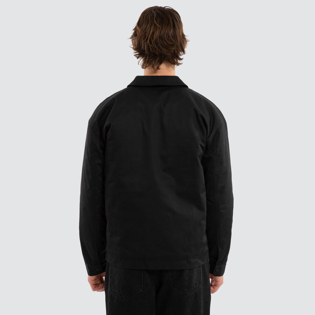 Model wears Frame Jacket Black Jackets in Black - Image 3