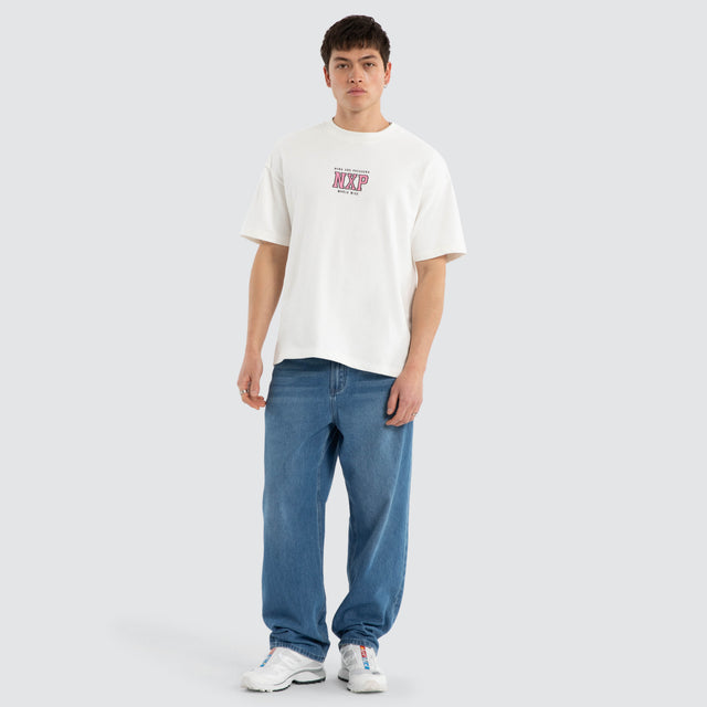 Model wears North Loopback Raptor Tee Natural White T-Shirts White – image 5