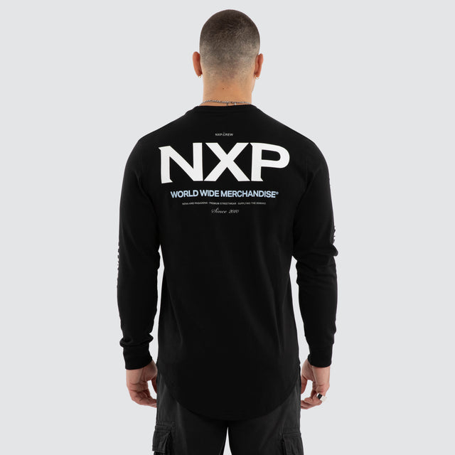 Model wears Peak Curved Hem Longsleeve Tee Black Longsleeve T-Shirts in Black - Image 1