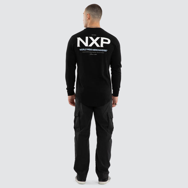 Model wears Peak Curved Hem Longsleeve Tee Black Longsleeve T-Shirts in Black - Image 4