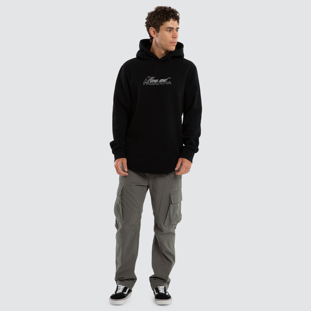 Model wears Umbran Dual Curved Hoodie Jet Black Hoodies Black – image 5