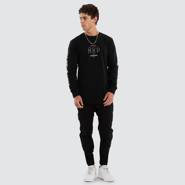 Model wears Nexus Dual Curved Longsleeve Tee Jet Black Longsleeve T-Shirts Black – image 5