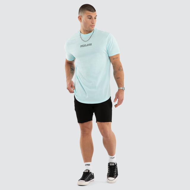 Model wears Dawnrise Curved Hem Tee Blue T-Shirts in Blue - Image 5