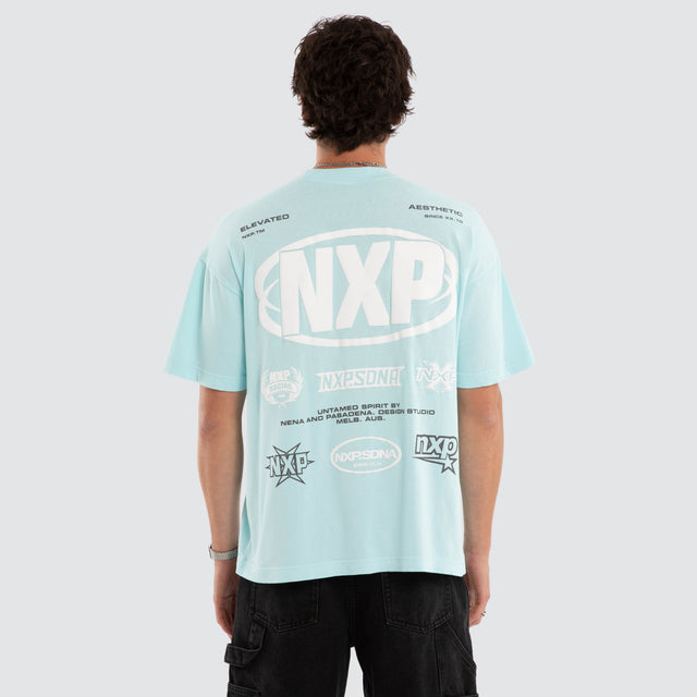 Model wears Palladium Box Fit Tee Blue T-Shirts in Blue - Image 2