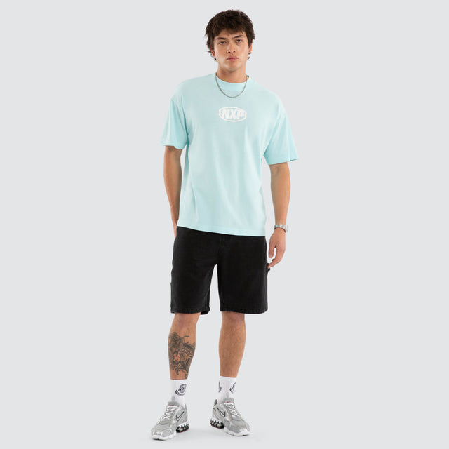 Model wears Palladium Box Fit Tee Blue T-Shirts in Blue - Image 4