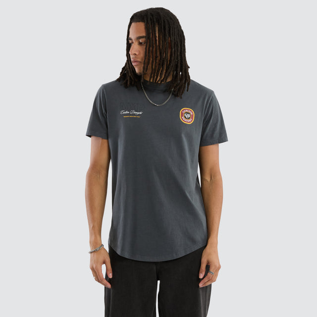 Model wears Carlton Draught General Dual Curved Tee Pigment Asphalt T-Shirts in Grey - Image 1