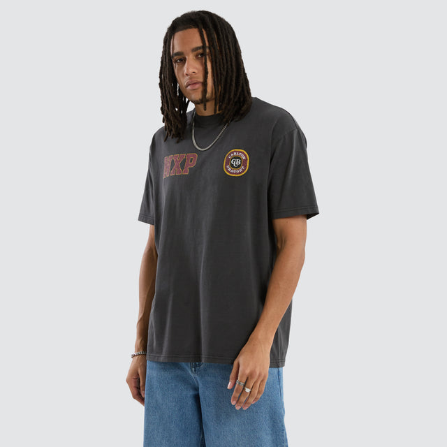 Model wears Carlton Draught Revival Box Fit Tee Pigment Black T-Shirts in Black - Image 1