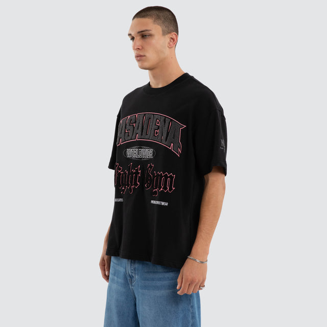 Model wears Gym Loopback Raptor Tee Anthracite Black T-Shirts in Black - Image 3