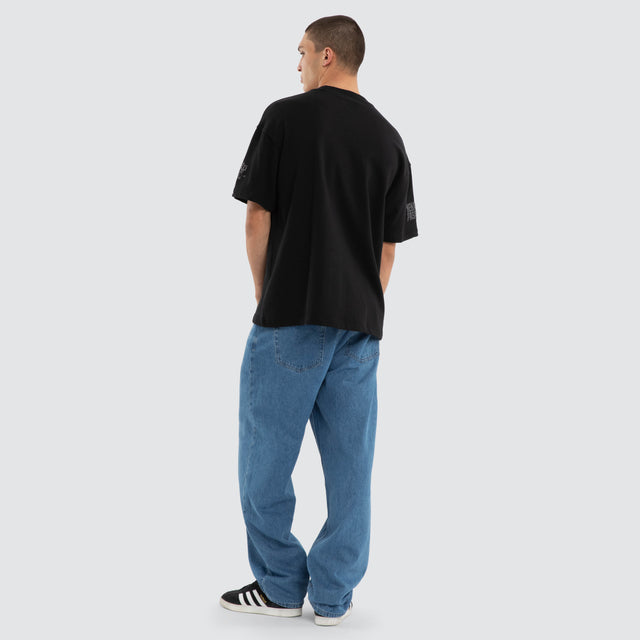 Model wears Gym Loopback Raptor Tee Anthracite Black T-Shirts in Black - Image 2