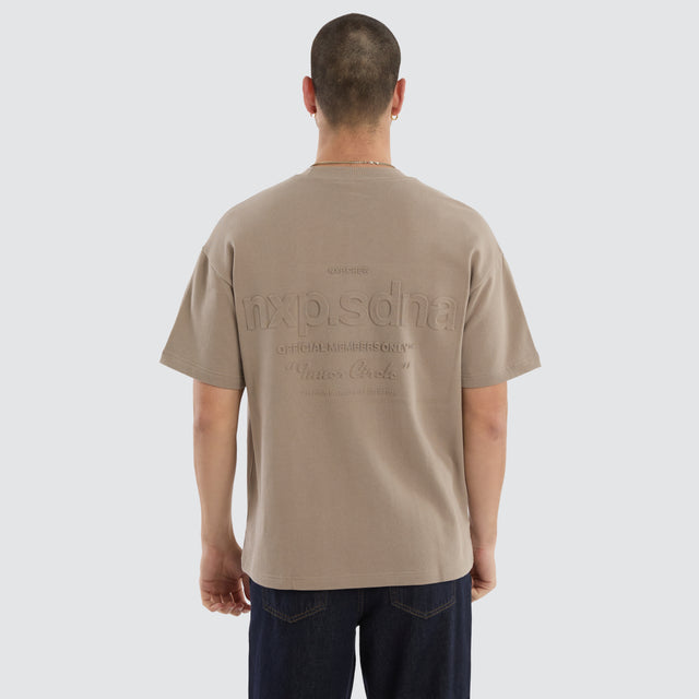 Model wears Overcome Raptor Tee Cinder T-shirt in brown - Image 2