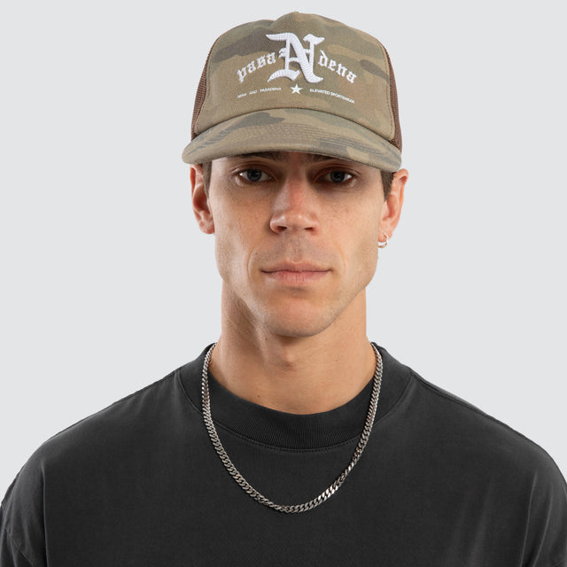 Model wears Technical Trucker Cap Airwolf Camo Caps Camo – image 2