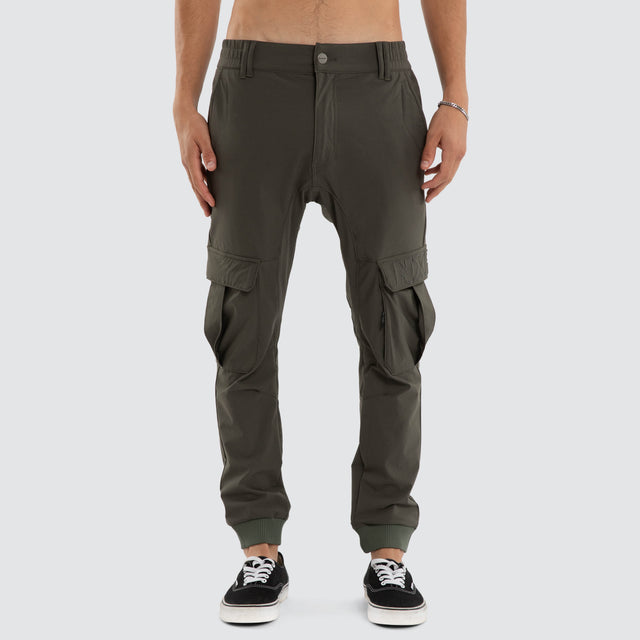 Model wears F150 Slim Nylon Cargo Jogger Dark Olive Pants in Green - Image 3