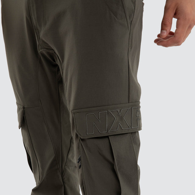 Model wears F150 Slim Nylon Cargo Jogger Dark Olive Pants in Green - Image 4