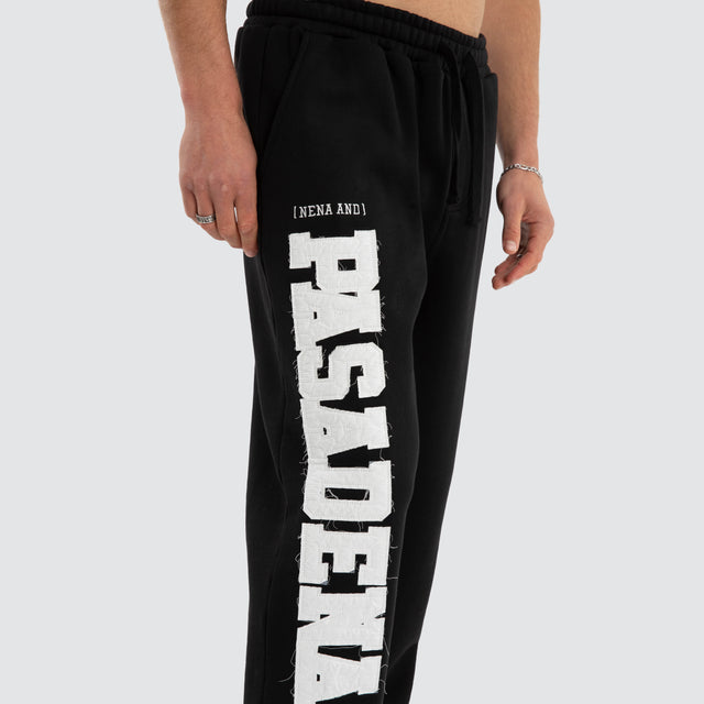 Model wears Realign Trackpant Jet Black Trackpants in Black - Image 2