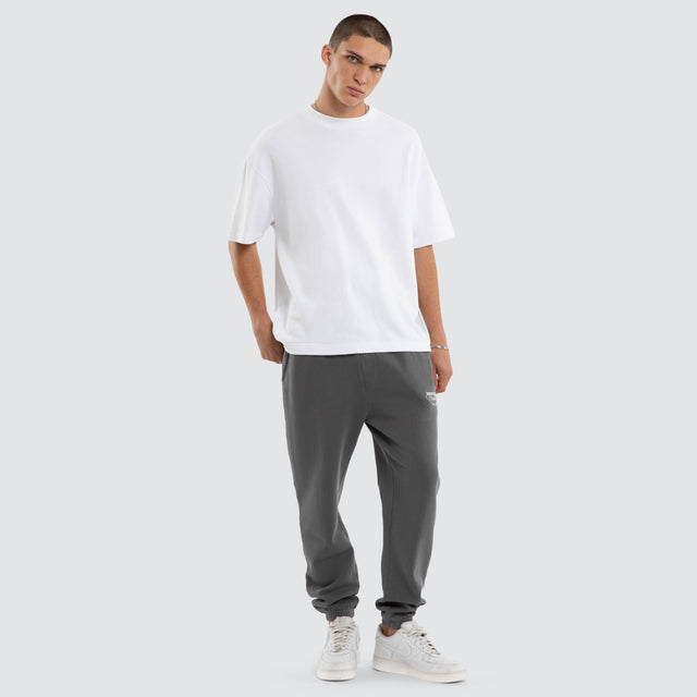 Model wears Capsule Trackpant Charcoal Trackpants in Grey - Image 4