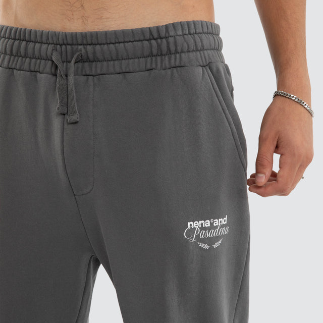 Model wears Capsule Trackpant Charcoal Trackpants in Grey - Image 5