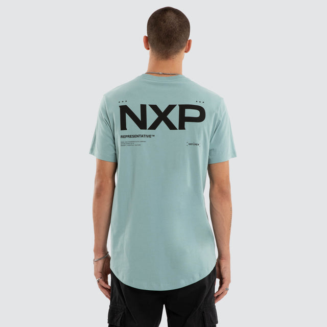 Model wears Crime Curved Hem Tee Cameo T-Shirts in Blue - Image 1