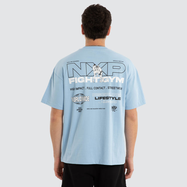 Model wears Script Raptor Tee Blue Bell T-Shirts Blue – image 1