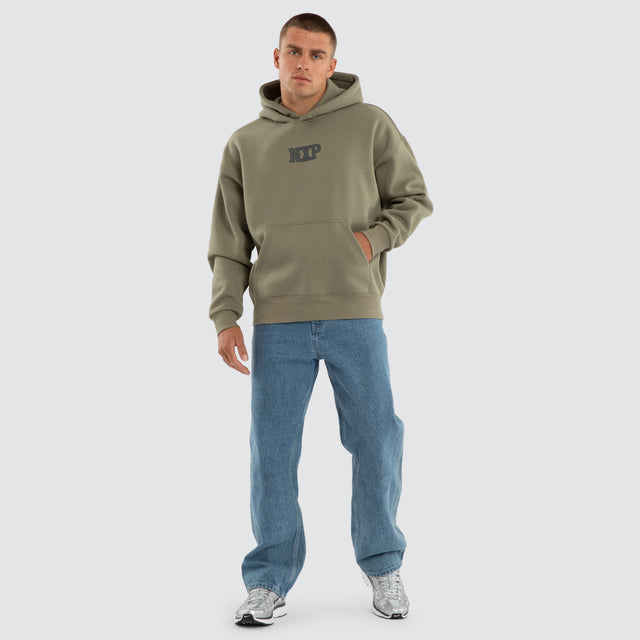 Model wears Foundation Box Fit Hoodie Khaki Green Hoodies in Green - Image 5