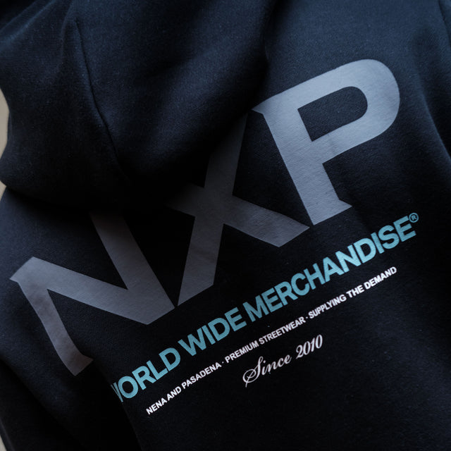 Model wears Peak Dual Curved Hoodie Jet Black Hoodies in Black - Image 3