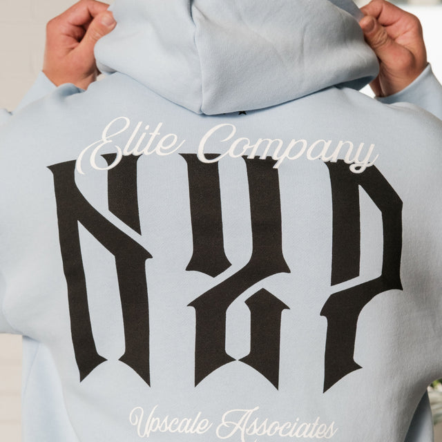 Model wears Dominate Relaxed Curved Hoodie Skyway Hoodies in Blue - Image 4