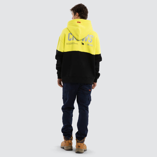 Model wears Adelaide Crows Block Hoodie Yellow Black Hoodies in Yellow - Image 4