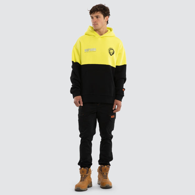 Model wears Brisbane Lions Block Hoodie Yellow Black Hoodies in Yellow - Image 5