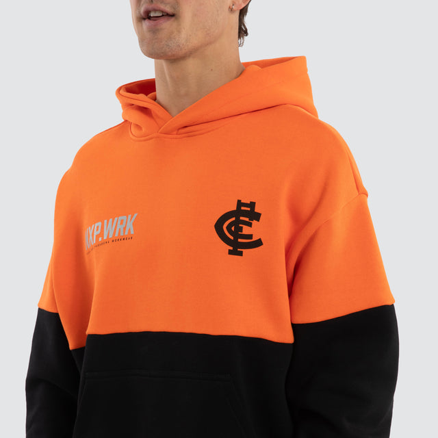 Model wears Carlton Blues Block Hoodie Orange Black Hoodies in Orange - Image 4