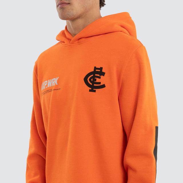 Model wears Carlton Blues Admission Hoodie Orange Hoodies in Orange - Image 4