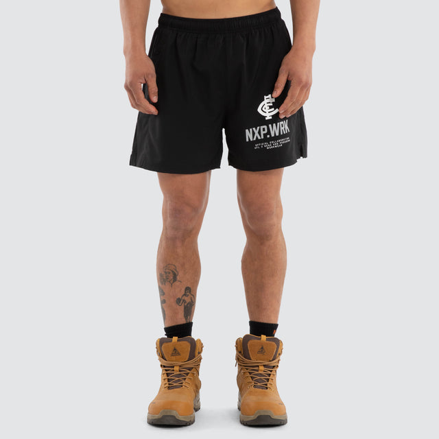 Model wears Carlton Blues Contract Short Jet Black Shorts in Black - Image 1