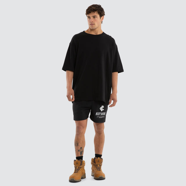Model wears Carlton Blues Contract Short Jet Black Shorts in Black - Image 4