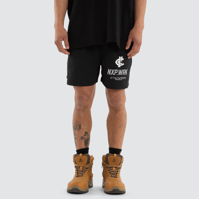 Model wears Carlton Blues Contract Short Jet Black Shorts in Black - Image 5