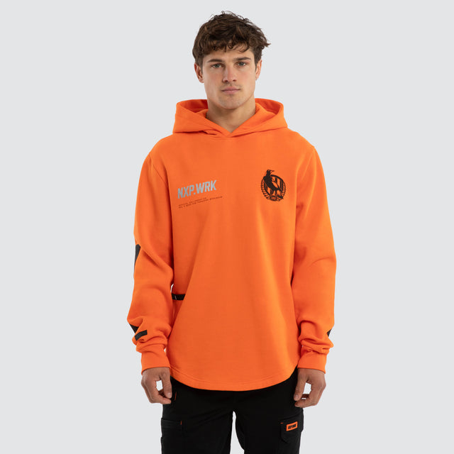 Model wears Collingwood Magpies Admission Hoodie Orange Hoodies in Orange - Image 1