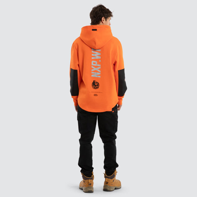 Model wears Collingwood Magpies Admission Hoodie Orange Hoodies in Orange - Image 5
