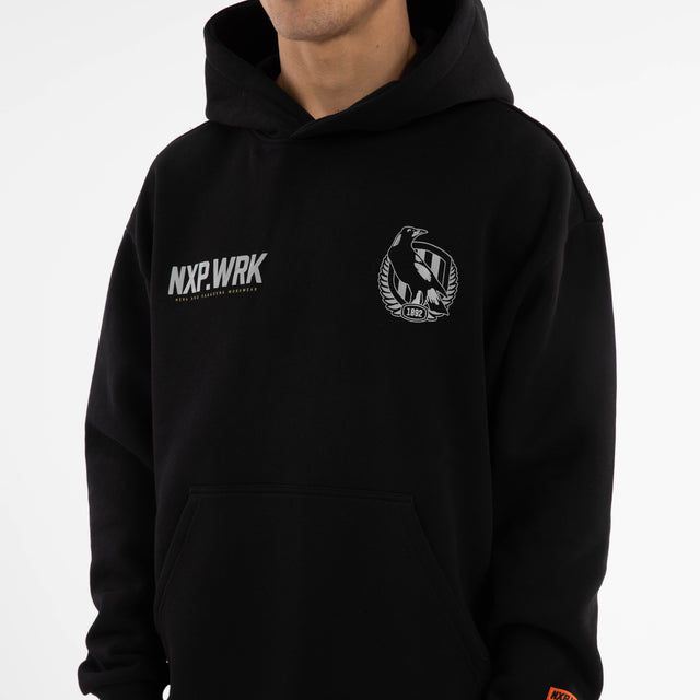 Model wears Collingwood Magpies Subject Hoodie Jet Black Hoodies in Black - Image 4