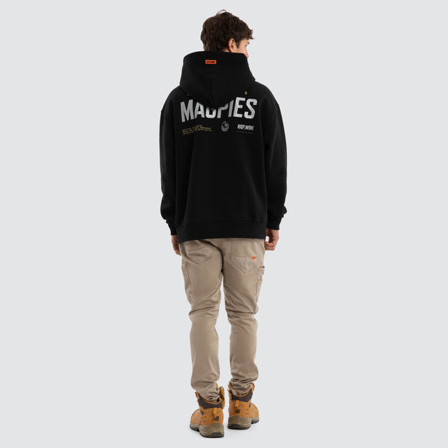 Model wears Collingwood Magpies Subject Hoodie Jet Black Hoodies in Black - Image 5