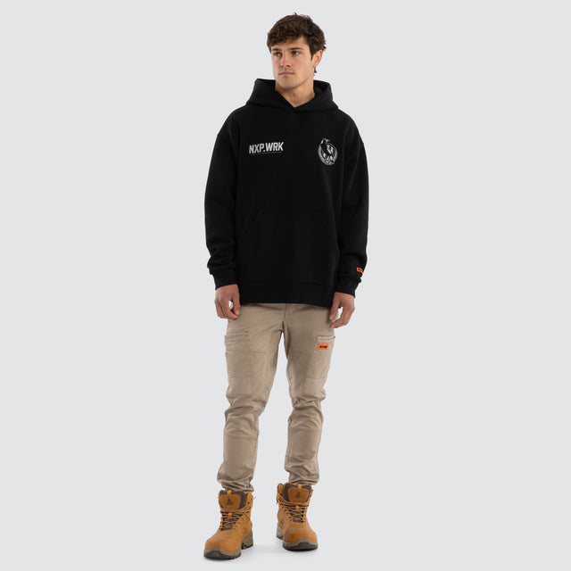 Model wears Collingwood Magpies Subject Hoodie Jet Black Hoodies in Black - Image 3