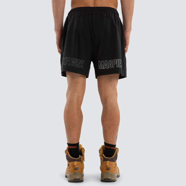 Model wears Collingwood Magpies Contract Short Jet Black Shorts in Black - Image 2
